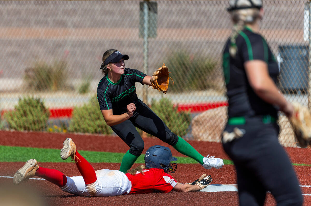 Coronado runner Mary Lou Tsunis (10) dives safely back to first base as Palo Verde infielder Ta ...