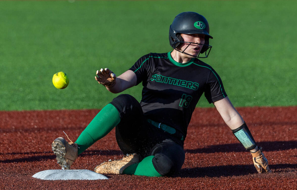 Palo Verde runner Mya Bartlett (18) slides safely at second base as a ball from Douglas bounces ...