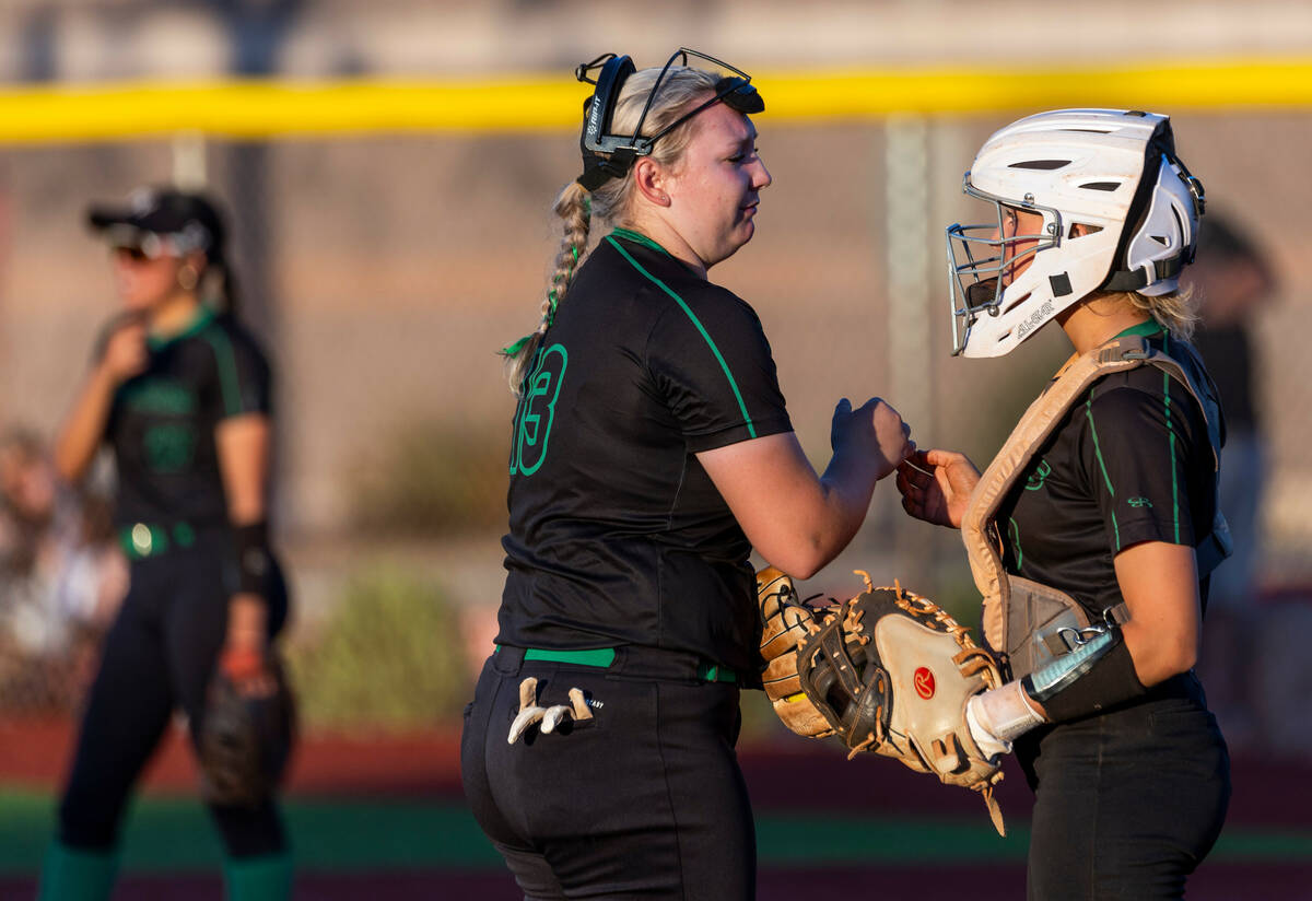 Palo Verde pitcher Bradi Odom (13) and catcher Madi Malloy (3) talk strategy against Douglas du ...