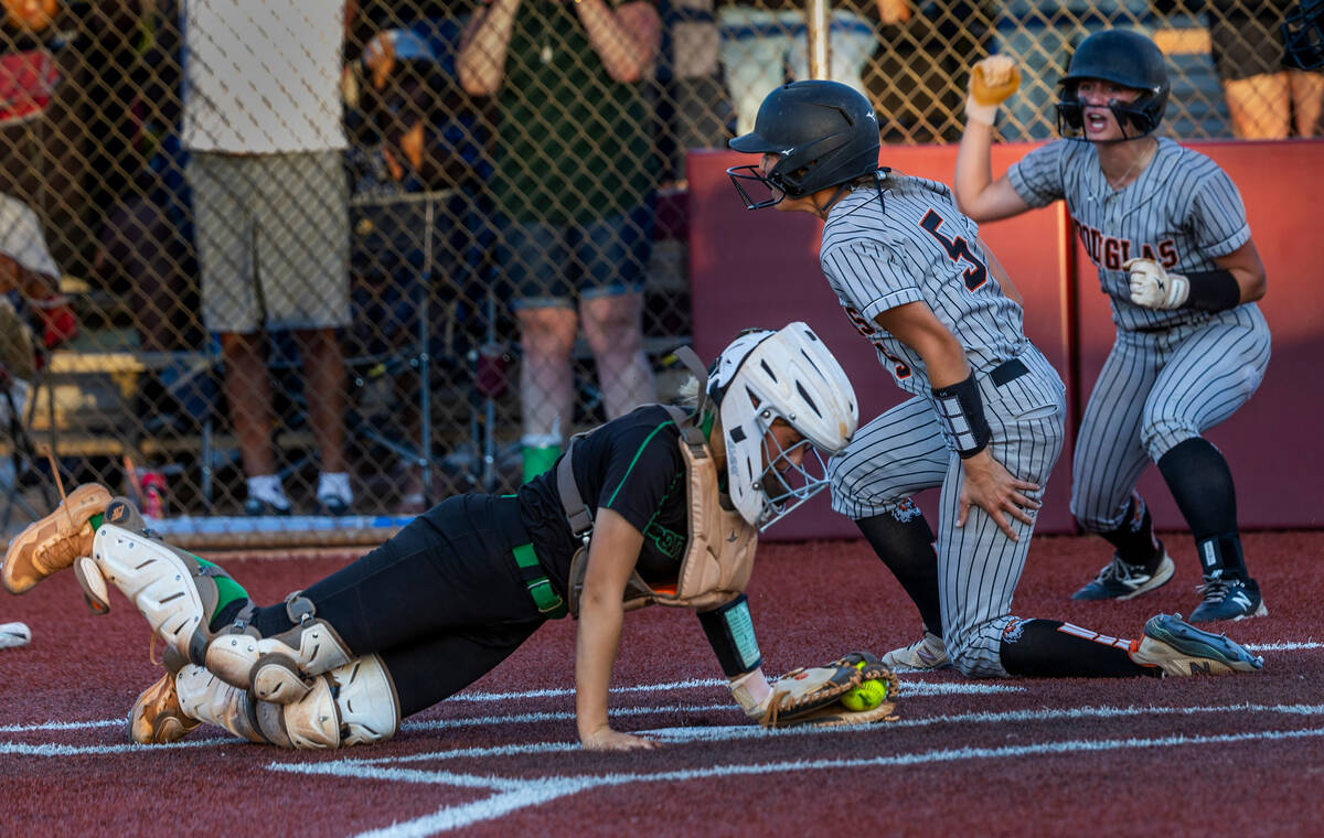 Palo Verde catcher Madi Malloy (3) is unable to make a tag in time as Douglas runner Ava Delane ...