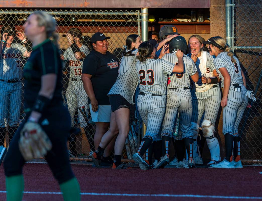 Douglas runner Ava Delaney (5) is celebrated by teammates after scoring what would be the game ...
