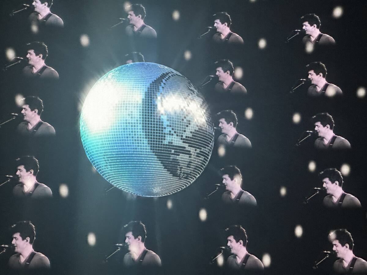 John Mayer and a Grateful Dead disco ball are shown during Dead & Company's opening night at th ...