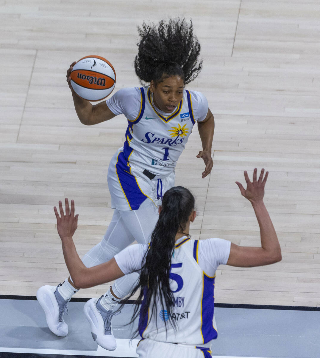 Los Angeles Sparks guard Zia Cooke (1) grabs an Aces rebound during the first half of their NBA ...