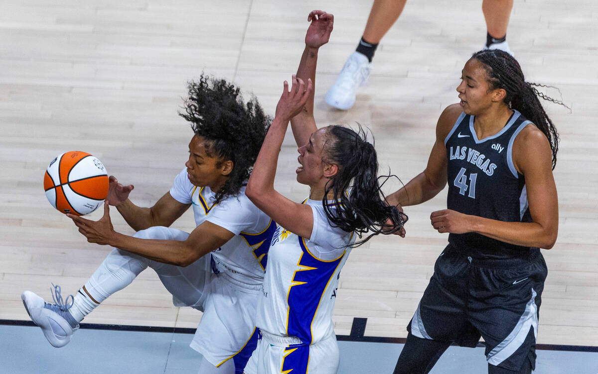 Los Angeles Sparks guard Zia Cooke (1) pulls down a rebound near forward Dearica Hamby (5) as A ...
