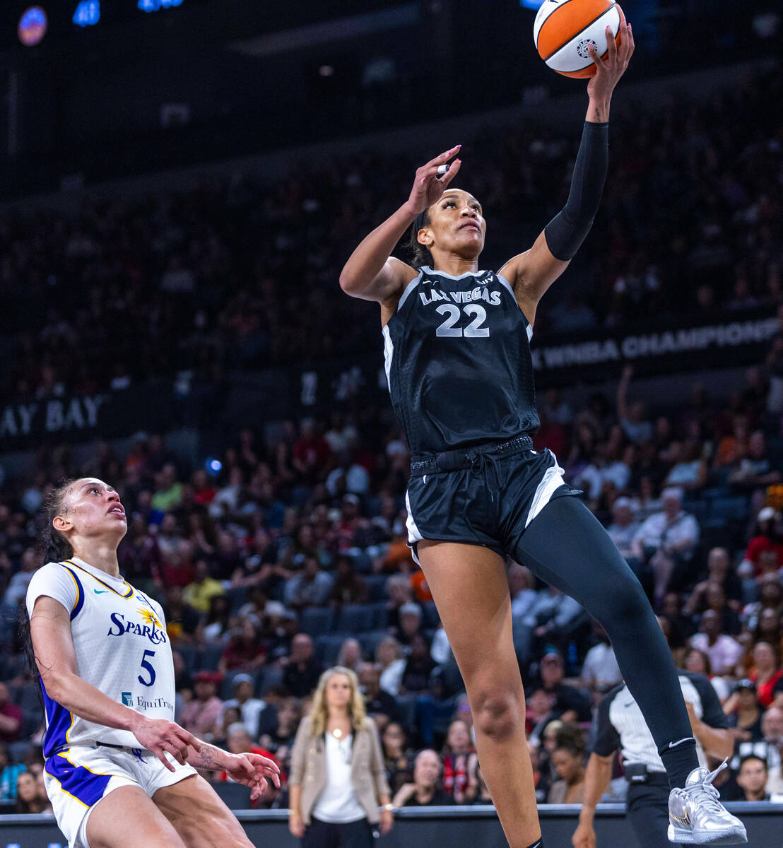 Aces center A'ja Wilson (22) goes underneath the basket for a layup beating Los Angeles Sparks ...