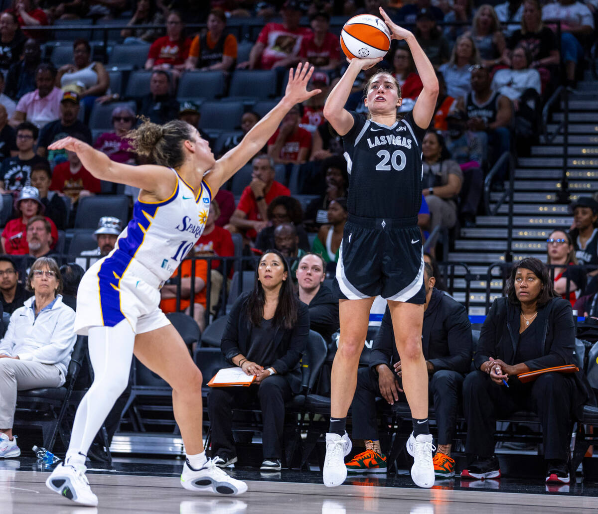 Aces guard Kate Martin (20) elevates for a shot over Los Angeles Sparks guard Kia Nurse (10) du ...