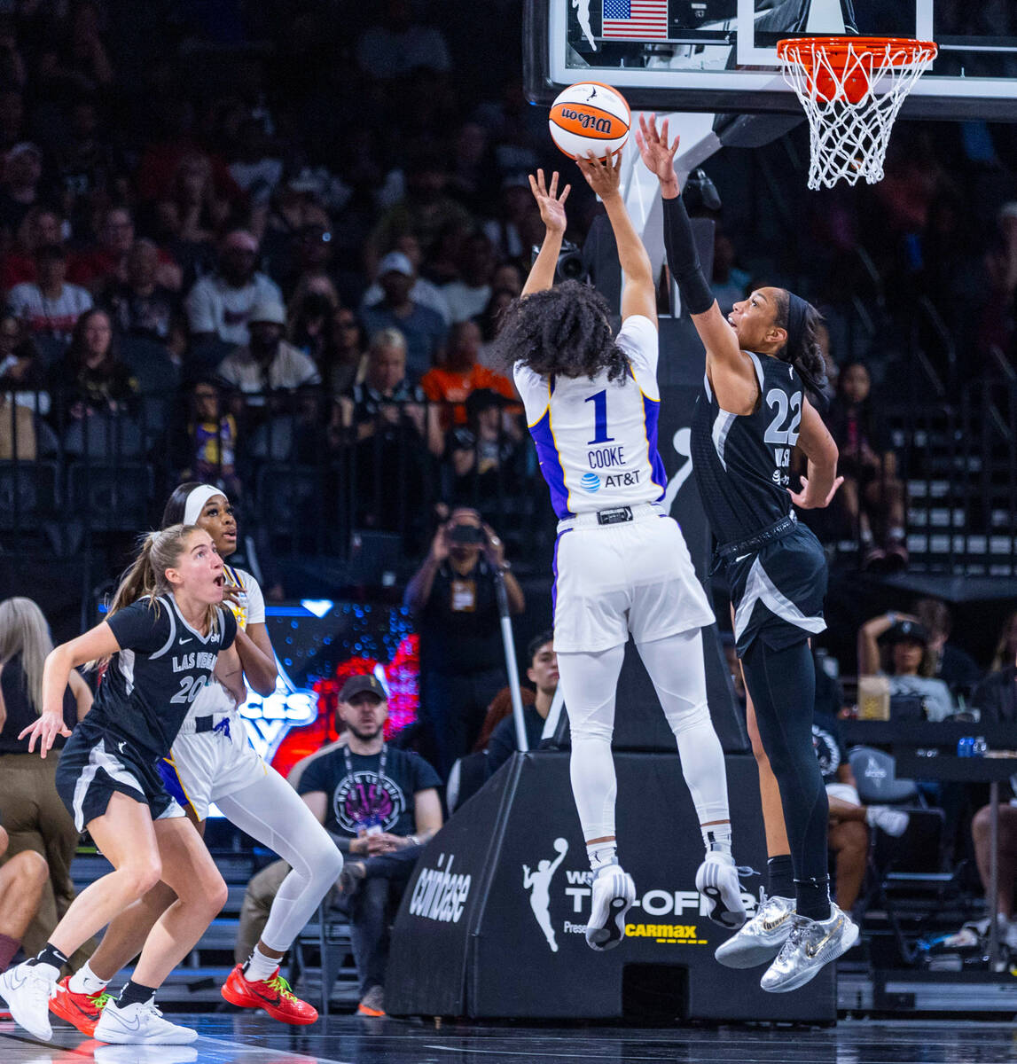 Los Angeles Sparks guard Zia Cooke (1) looks to shoot as Aces center A'ja Wilson (22) defends d ...