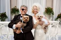 Norm Clarke and Cara Roberts, with Rumor, left, and Scandal, celebrate their nuptials Saturday, ...