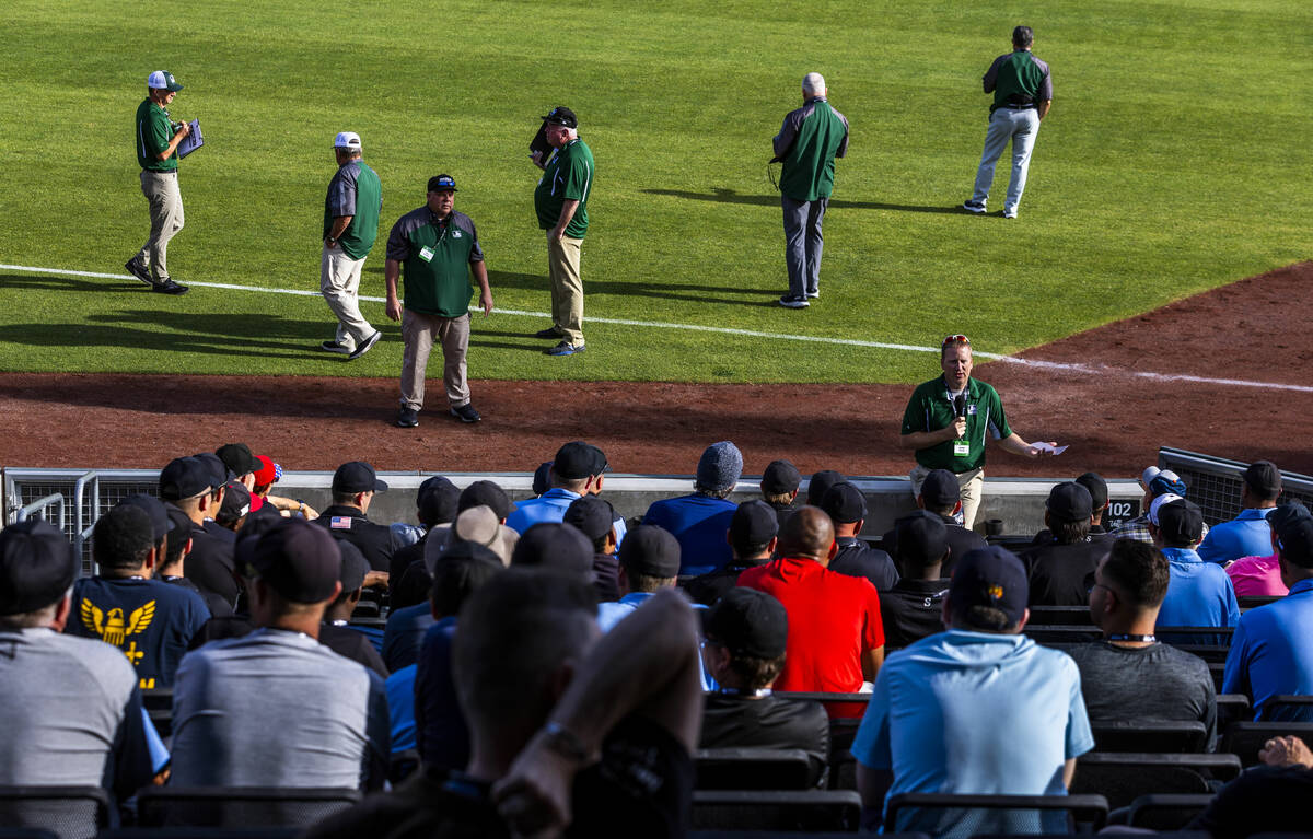 Staffers answer questions for participants during a Major League camp for umpires at the Las Ve ...