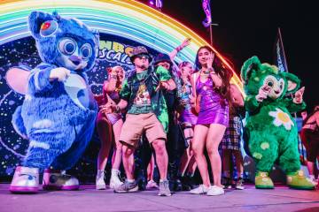The Rainbow Rascals dance with festival attendees during the second day of the Electric Daisy C ...