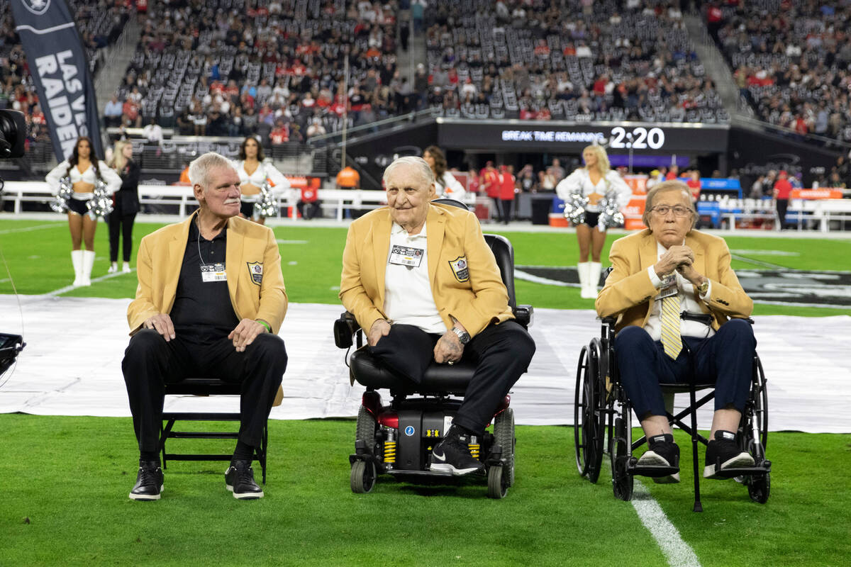 Raiders Hall of Famers, from left, Ted Hendricks, Jim Otto and Tom Flores on the field for Char ...