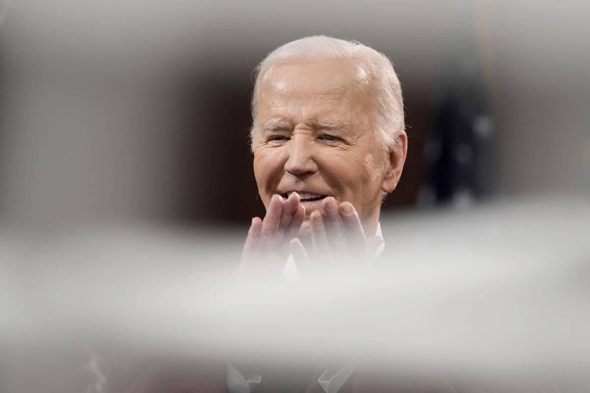 President Joe Biden claps before speaking to graduating students at the Morehouse College comme ...