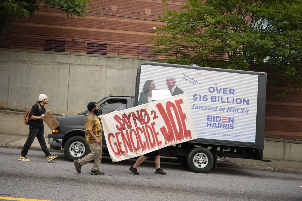 People protest near the commencement at Morehouse College, Sunday, May 19, 2024, in Atlanta. (A ...