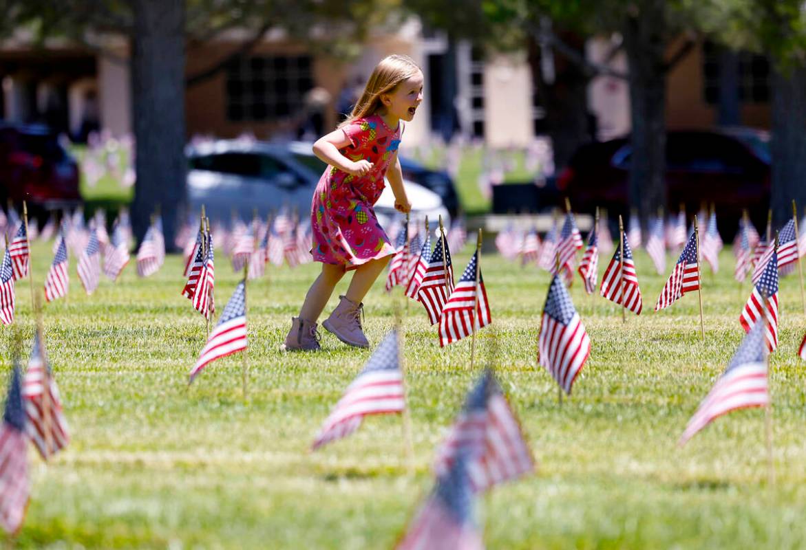 Mila Lukac, 5, plays at the Southern Nevada Veterans Memorial Cemetery on Memorial Day Monday, ...