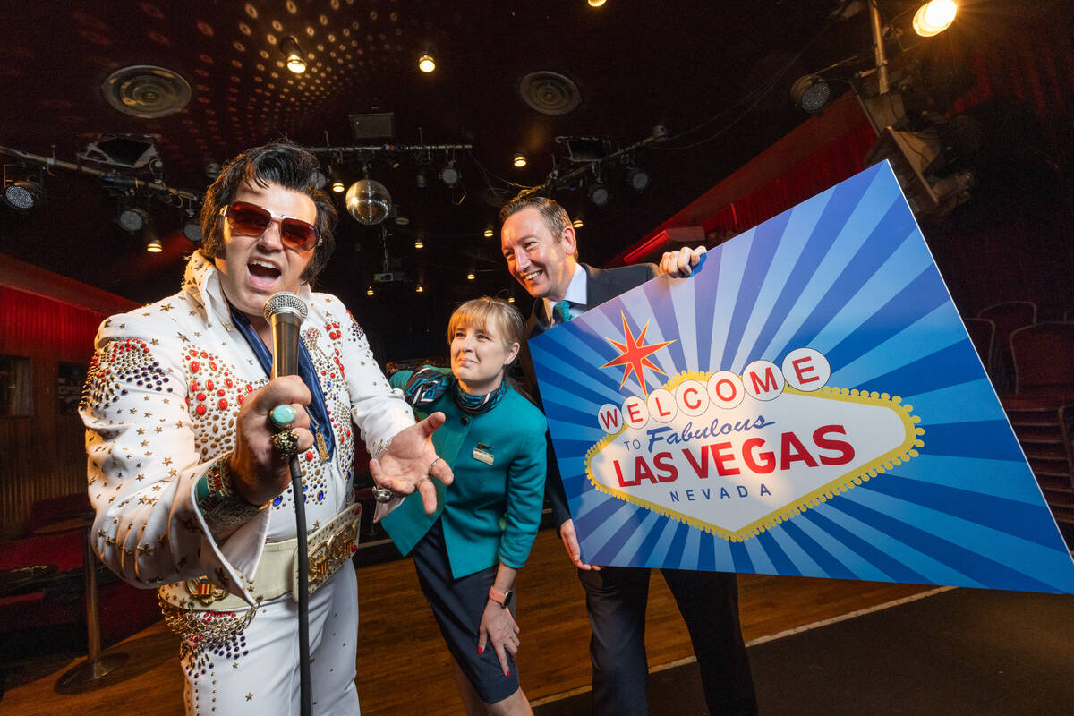 Elvis Presley impersonator Ciarán Houlihan with Aer Lingus cabin crew members Wendy Seong and ...