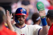 Philadelphia Phillies' Bryce Harper celebrates with teammates during the baseball game against ...