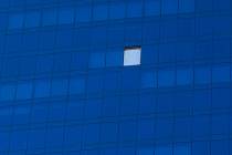 A broken window covered by a white tarp was observed at the Elara by Hilton Grand Vacations on ...