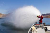A fireboat discharges it's water canon during a safe boating media event at the Lake Mead Natio ...