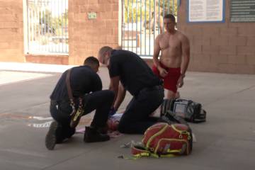 Members of the Henderson Fire Department conduct a mock drowning drill as part of a water safet ...