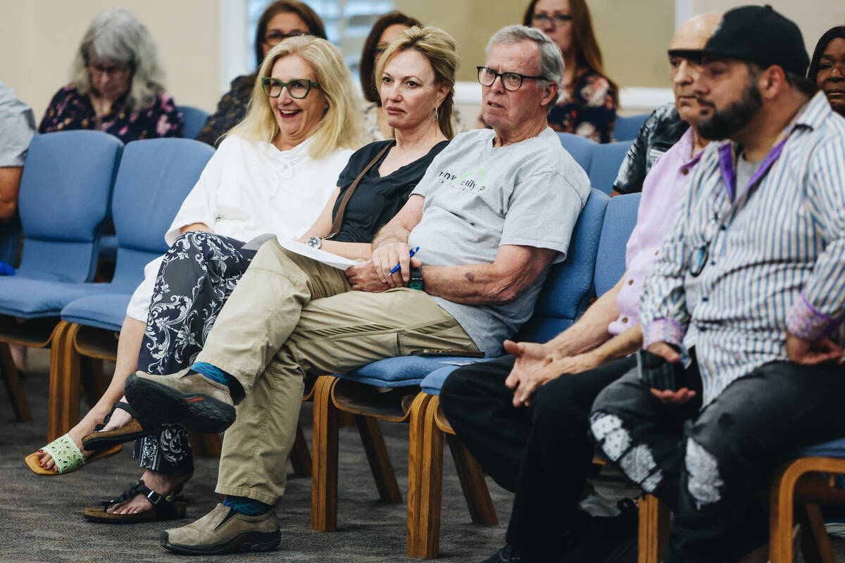 Members of the crowd react to mayoral candidate Kara Jenkins during a forum for the candidates ...