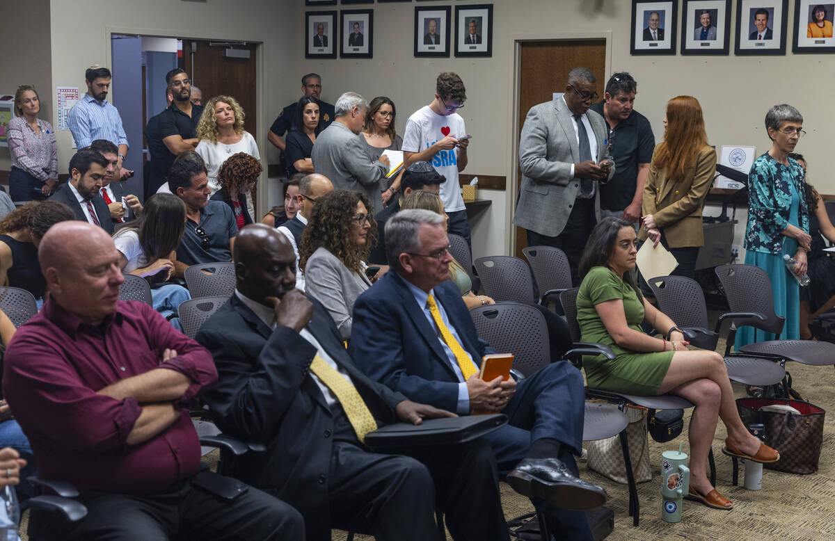 Individuals line up for public comment during an NSHE Board of Regents meeting where pro-Israel ...