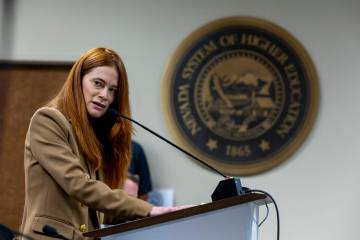 Colleen Freedman with the UNLV William S. Boyd School of Law looks to UNLV President Keith Whit ...