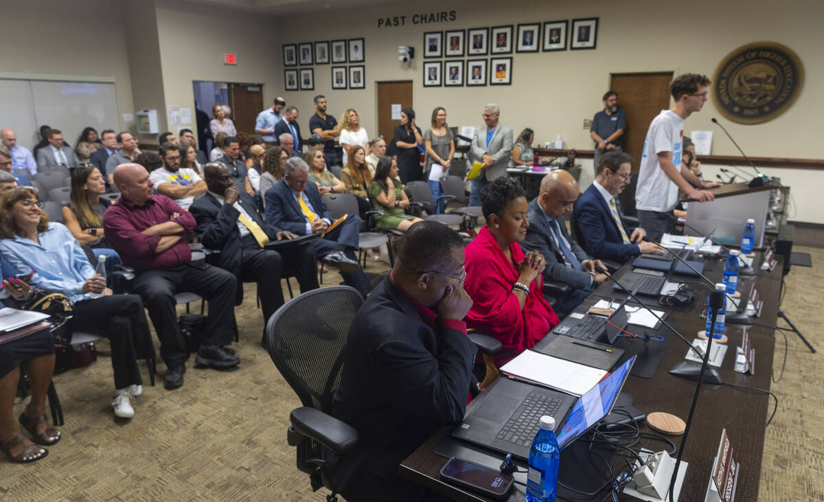 UNLV President Keith Whitfield, bottom, listens in as sophomore Lev Aton makes a public comment ...