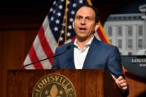 Louisville Mayor Craig Greenberg speaks to reporter during a press conference Thursday, May 23, ...