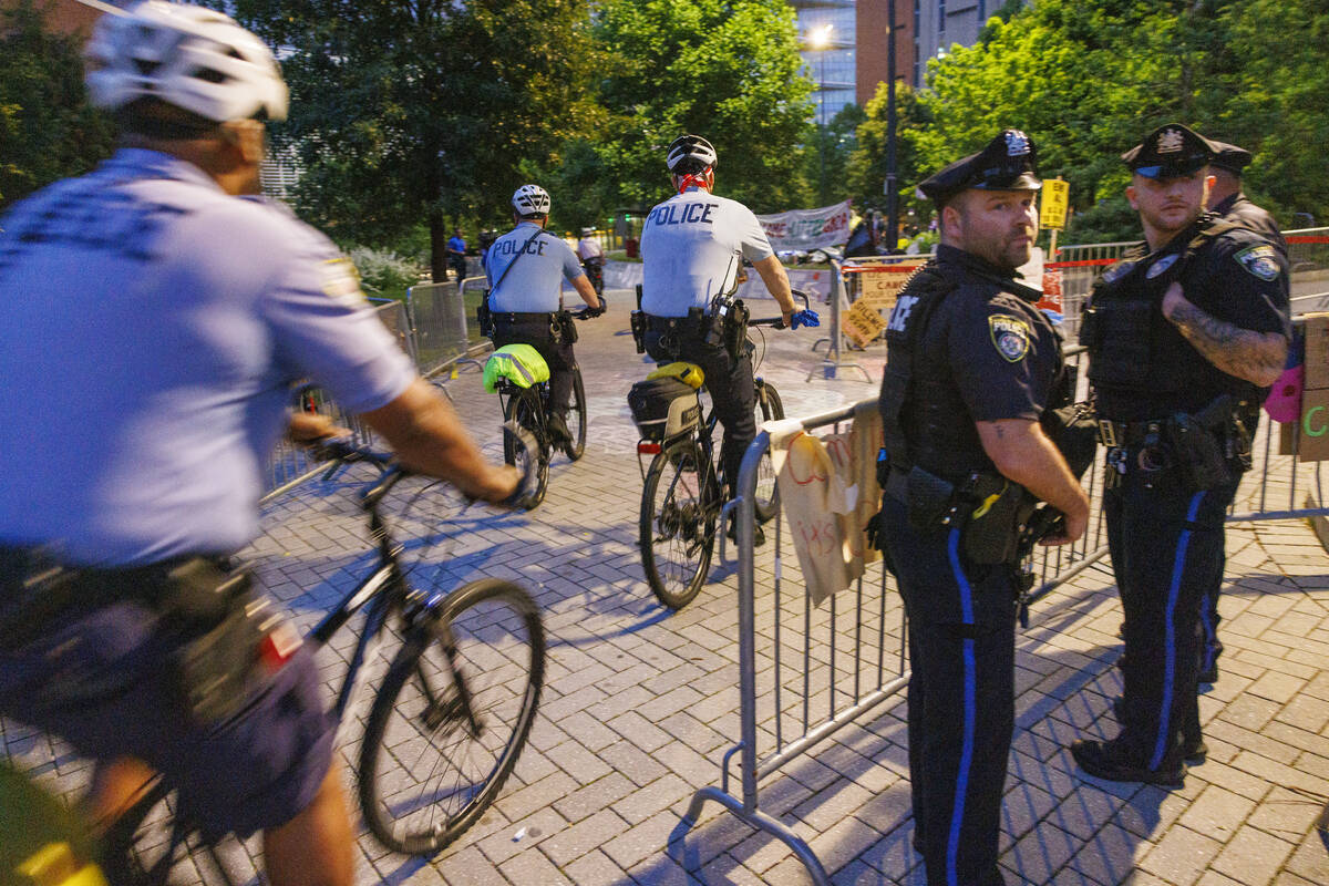 Police stand by as protestors prepare to leave a pro-Palestinian encampment at Drexel Universit ...