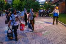 Protesters leave a pro-Palestinian encampment at Drexel University early Thursday, May 23, 2024 ...