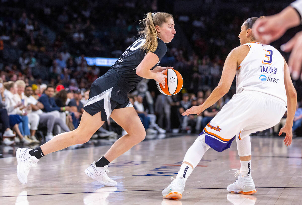 Aces guard Kate Martin (20) drives around Phoenix Mercury guard Diana Taurasi (3) during the fi ...