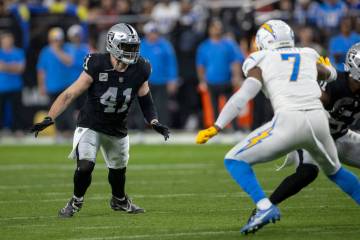 Raiders linebacker Robert Spillane (41) defends as Los Angeles Chargers tight end Gerald Everet ...