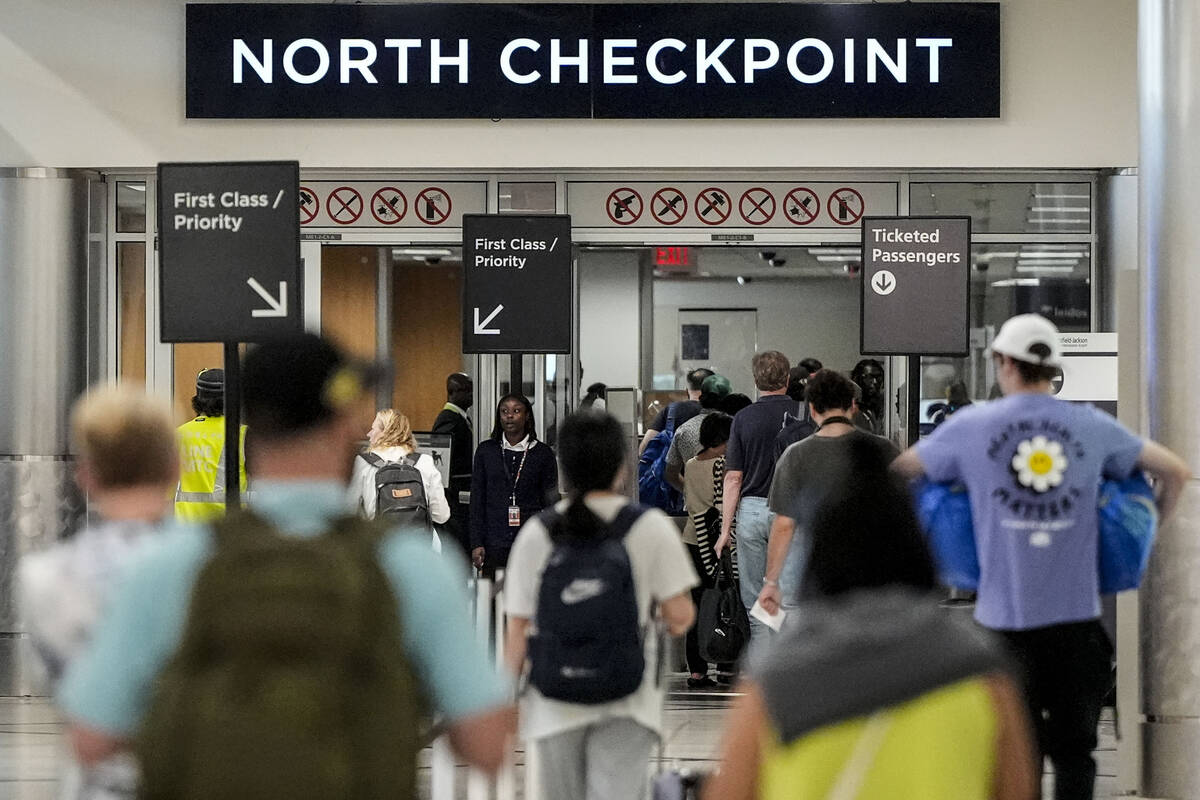 Travelers move through Hartsfield-Jackson Atlanta International Airport ahead of Memorial Day, ...