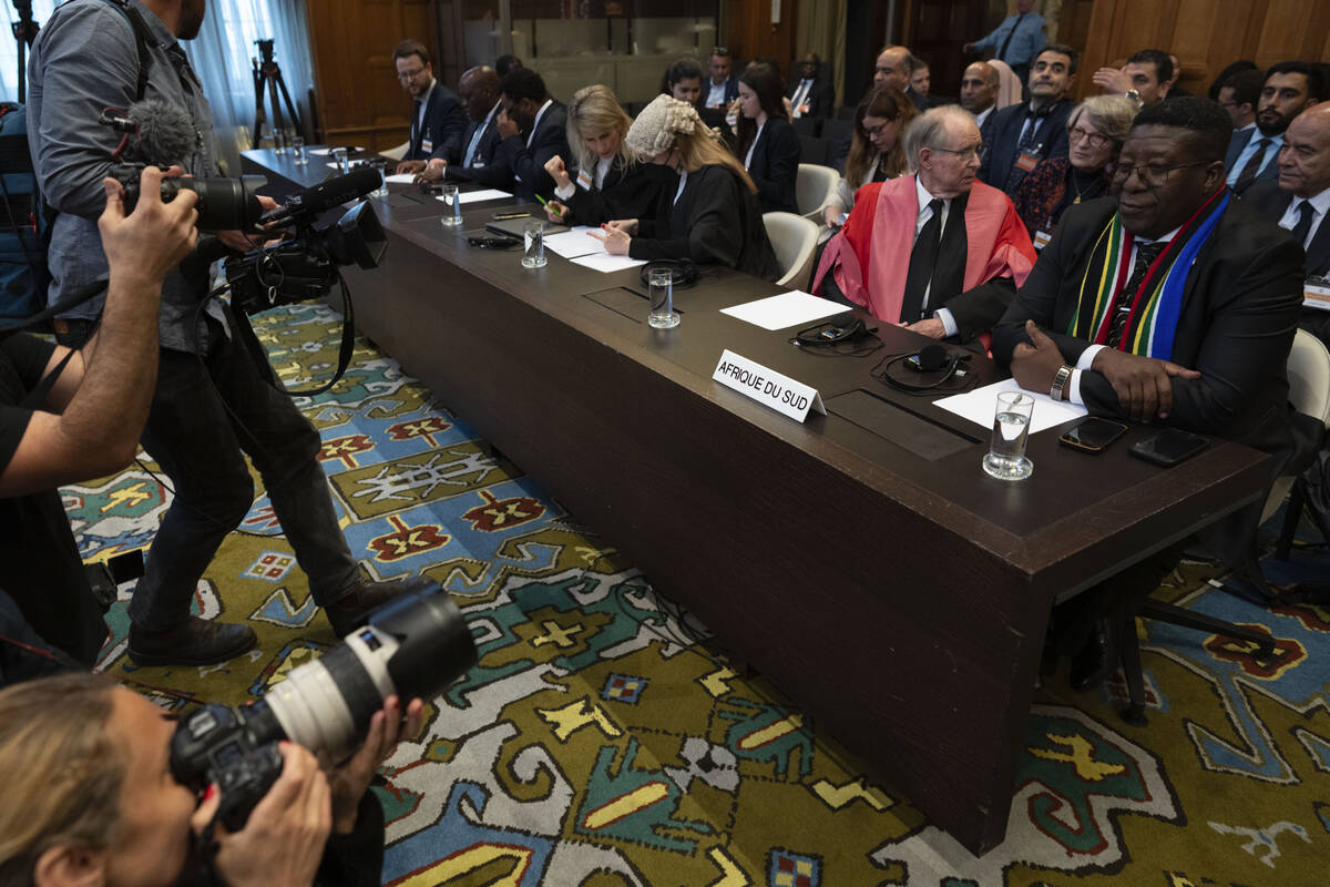 Journalists took images of South Africa's legal team, with Ambassador of the Republic of South ...