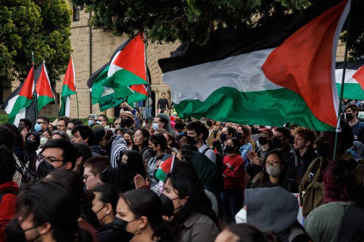 Pro-Palestinian demonstrators listen to a speaker as they protest at Stanford University urging ...