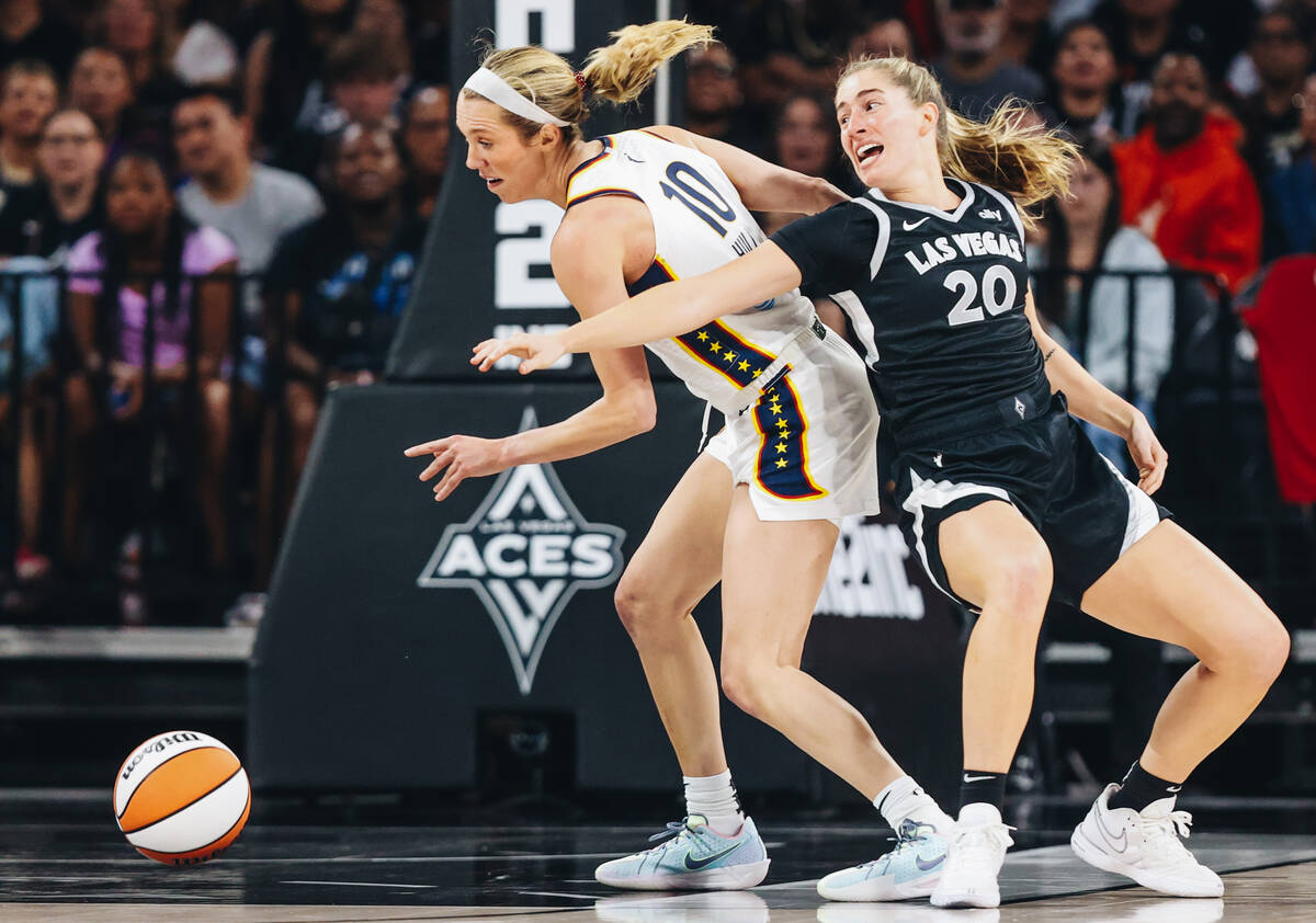 Aces guard Kate Martin (20) fights to reach the ball as it escapes Indiana Fever guard Lexie Hu ...