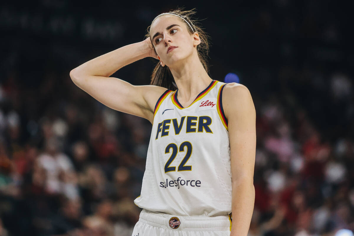 Indiana Fever guard Caitlin Clark (22) reacts to fouling an Aces player during a game between t ...