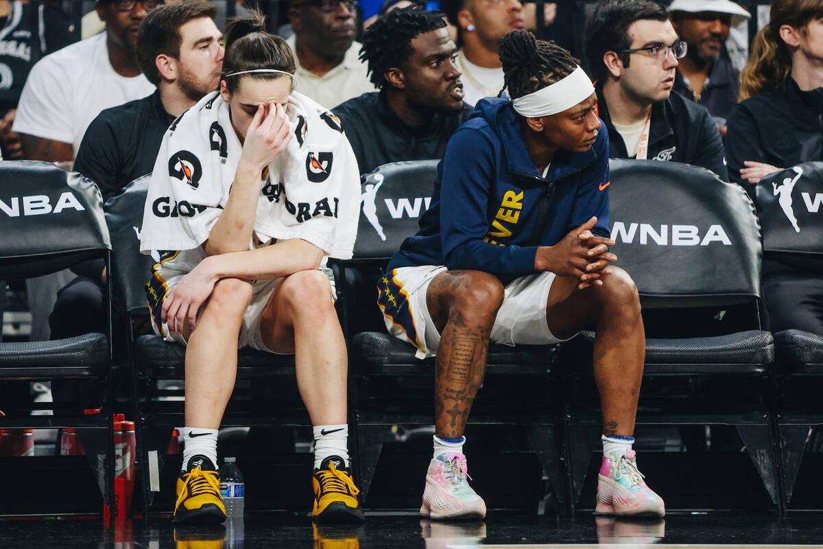 Indiana Fever guard Caitlin Clark (22) puts her hand to her face as the Fever trail the Aces du ...