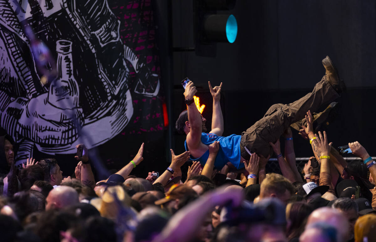A fan crowd surfs as Gorilla Biscuits perform during the Punk Rock Bowling music festival at Do ...