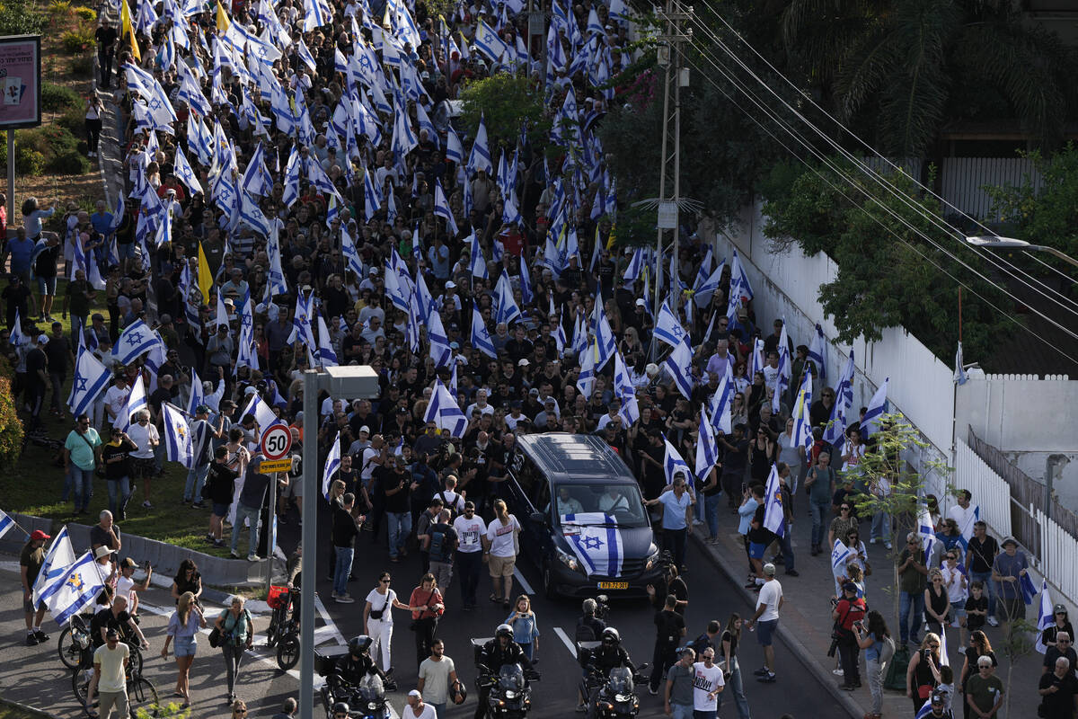 Israelis attend the funeral of Hanan Yablonka, who was killed during Hamas' Oct. 7, 2023 attack ...