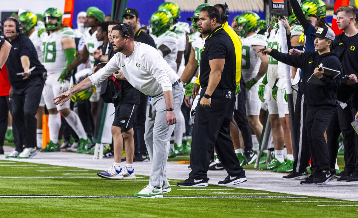 Oregon Ducks head coach Dan Lanning signals a play against the Washington Huskies during the se ...