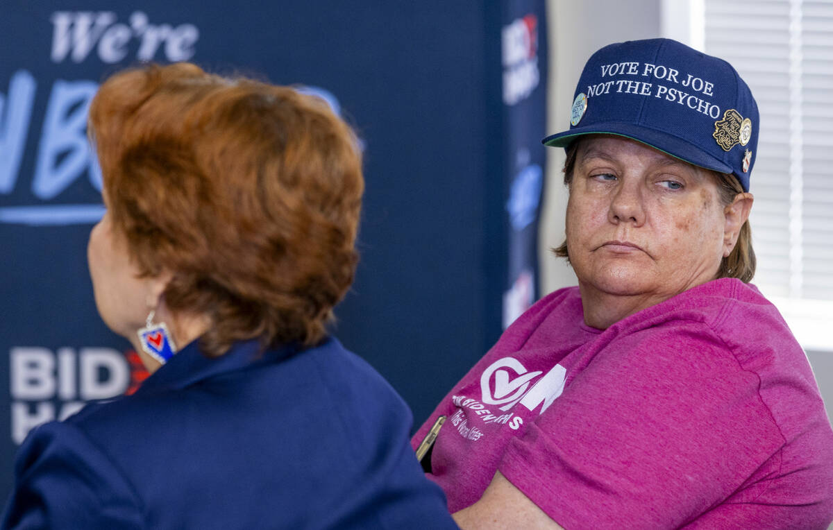 Mary Dungan wears her unique hat as friend Donna West sports Nevada earrings during a press con ...