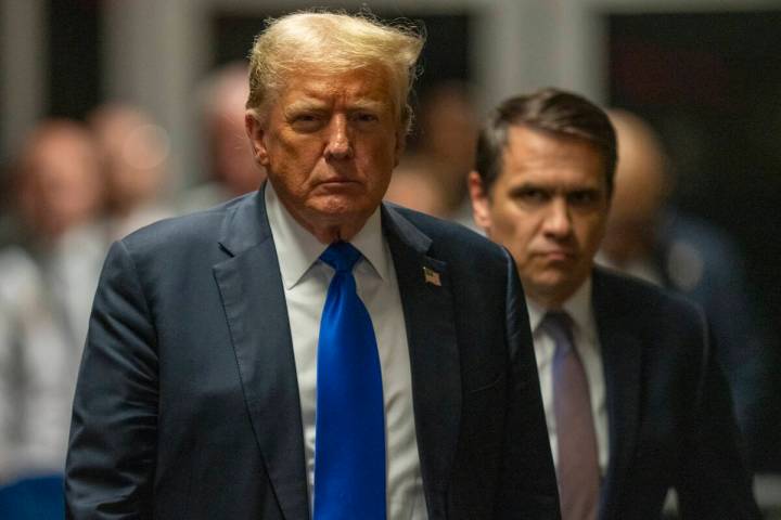 Former President Donald Trump walks outside of Manhattan Criminal Court after a jury convicted ...