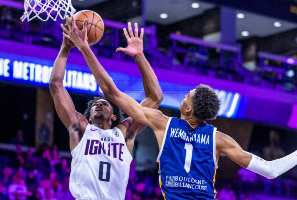 NBA G League Ignite guard Scoot Henderson has a shot rejected by Metropolitans 92 center Victor ...