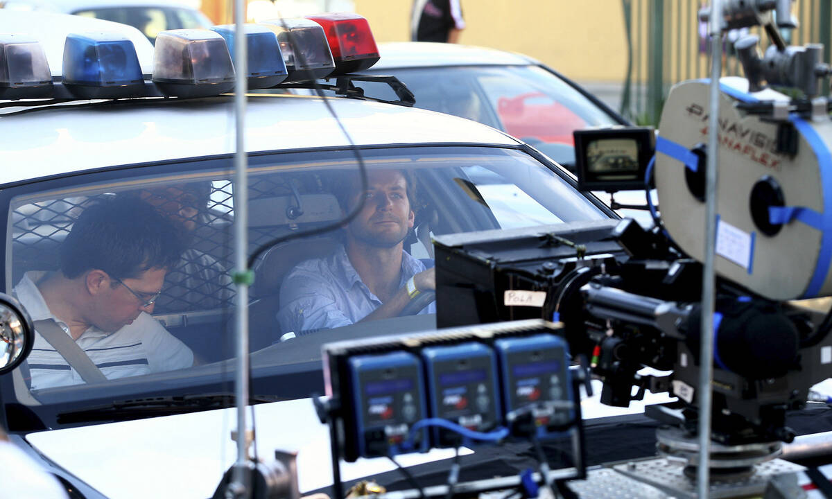 The stars of the movie "The Hangover" Bradley Cooper (driver), Ed Helms (passenger ), & Zach Ga ...