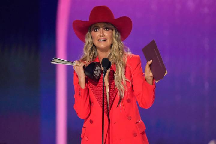 Lainey Wilson accepts the award for entertainer of the year during the 59th annual Academy of C ...