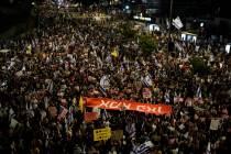 FILE - People protest against Israeli Prime Minister Benjamin Netanyahu's government and call f ...