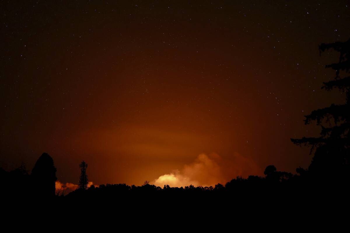 This image provided by the U.S. Geological Survey, seen from the Volcano Golf Course, shows a p ...
