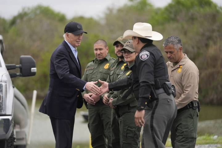 President Joe Biden talks with the U.S. Border Patrol and local officials, as he looks over the ...