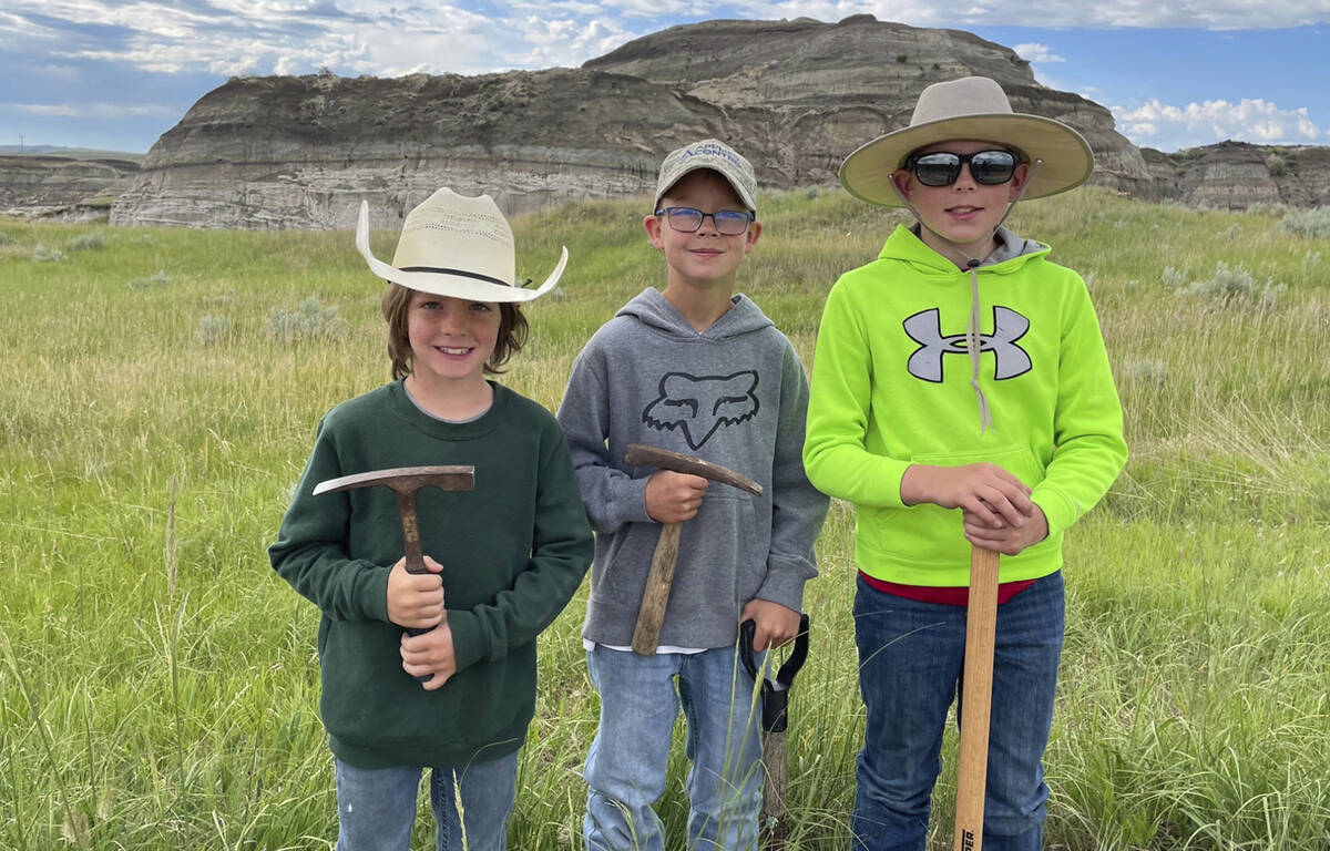 In this image provided by Giant Screen Films, Liam Fisher, Kaiden Madsen and Jessin Fisher pose ...